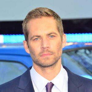 Here's an alt tag for the image: Paul Walker, actor, in suit.