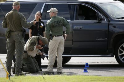 Texas Rangers investigate crime scene.