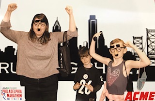 A woman and two children posing for a picture.