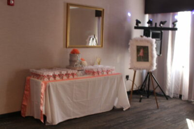 A table with cake and a mirror in the background
