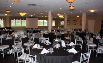 A room with tables and chairs in it