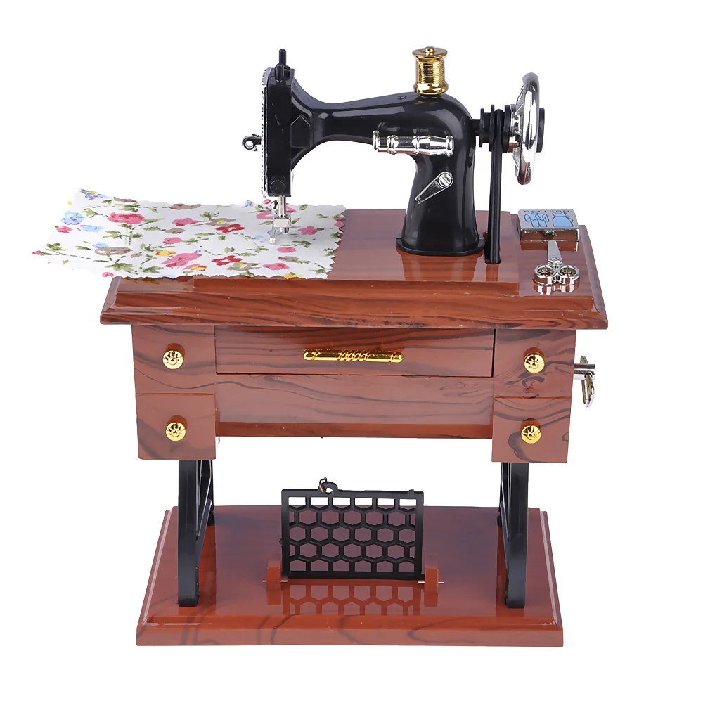 Vintage sewing machine music box toy.