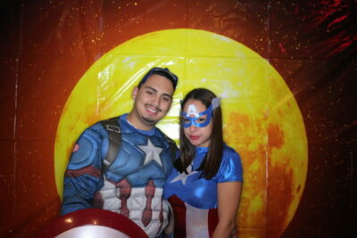 A man and woman dressed as captain america.