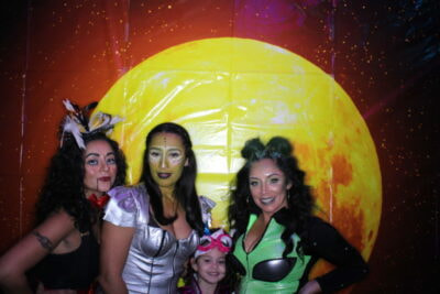 A group of women dressed up in costumes.