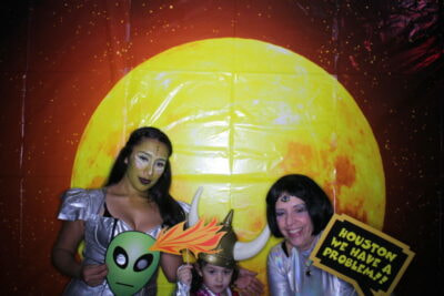 A group of people in costumes posing for the camera.