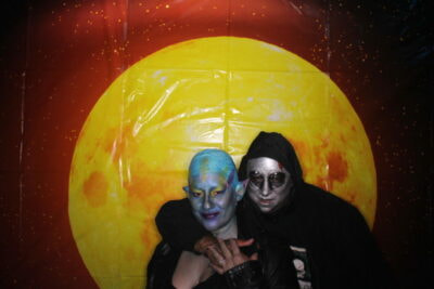 Two people in costumes posing for a picture.
