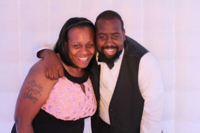 A man and woman posing for the camera.
