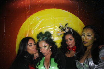 A group of women posing for the camera.