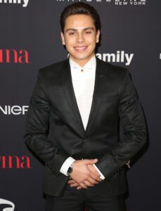 Here's an alt tag for the image: `Ethan Dolan at a red carpet event`